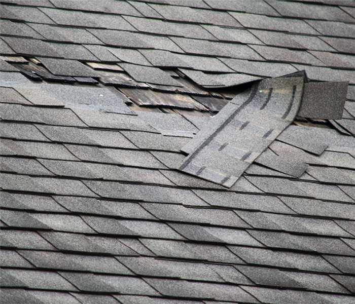 shingles falling off of a roof